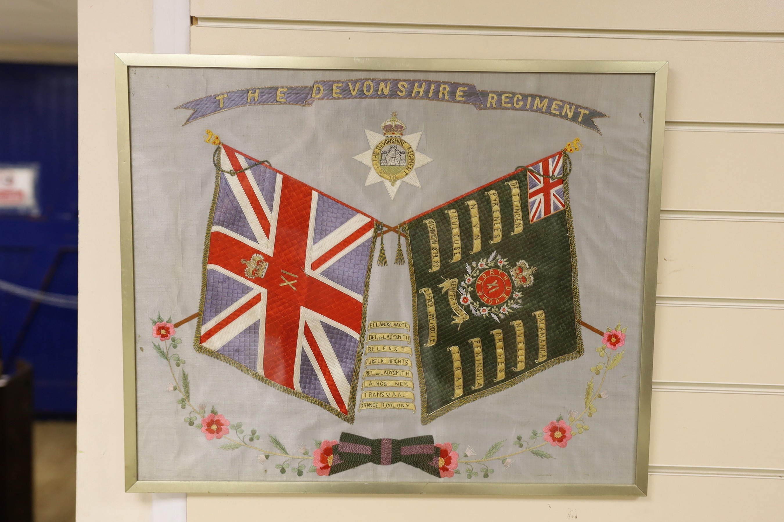 Two Regimental embroidered silk pictures, Kings and Regimental colours